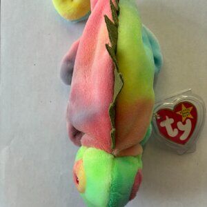 Ty product Iggy the Iguana is about 5-6 inches long, made of polyester fabric.